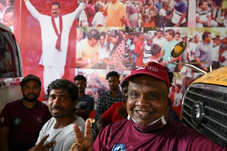Supporters of Prime Minister Mahinda Rajapaksa celebrate election win near his home in the southern town of Tangalle, Sri Lanka [Lakruwan Wanniarachchi/AFP]