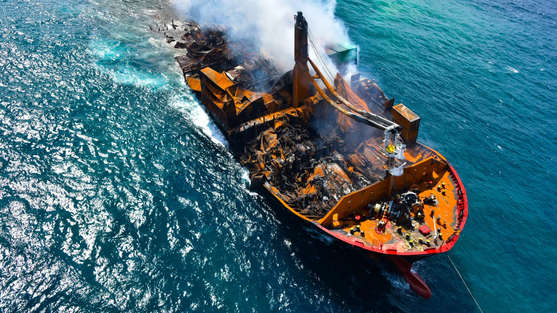 Smoke rises from a fire onboard the MV X-Press Pearl vessel as it sinks [Image via Reuters]