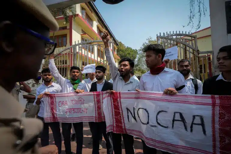 Students protesting against the CAA in Guwahati, Assam [Anupam Nath/AP]