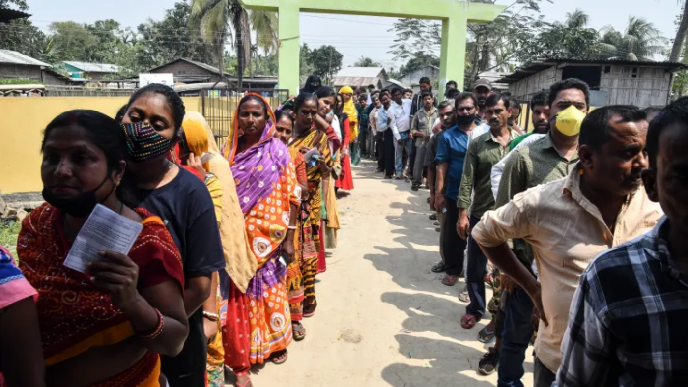 18th Lok Sabha Elections in India: Voters line up to cast their ballots during phase one of Assam's state election in Koliabor [Dibyangshu Sarkar/AFP].
