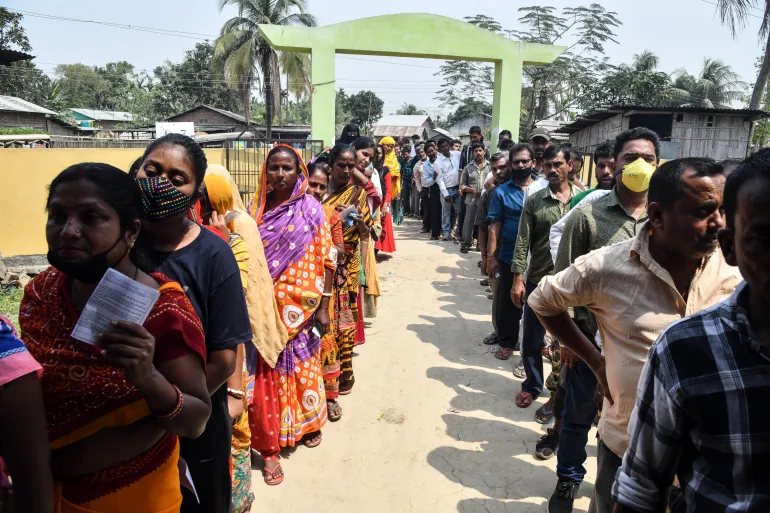 18th Lok Sabha Elections in India: Voters line up to cast their ballots during phase one of Assam's state election in Koliabor [Dibyangshu Sarkar/AFP].