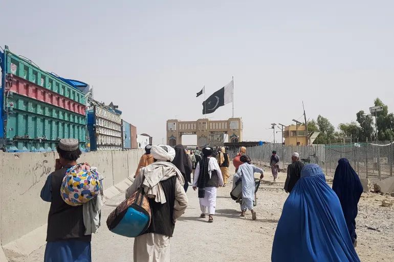 Pakistan's Afghan policy: People crossing into Pakistan from Afghanistan are making their way through the Friendship Gate in Chaman [Image via Reuters].
