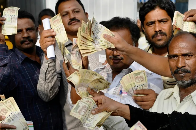 In 2016, hundreds of thousands of Indians queued outside banks for days, seeking to exchange their cash savings for the new legal tender [Getty Images].