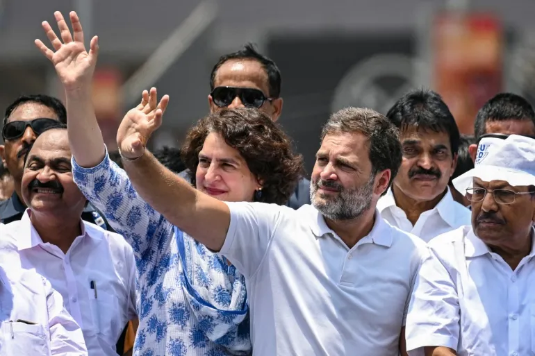 India's Congress party leader Rahul Gandhi, and his sister Priyanka Gandhi Vadra greeting supporters during a roadshow on April 3, 2024 [Image via AFP]