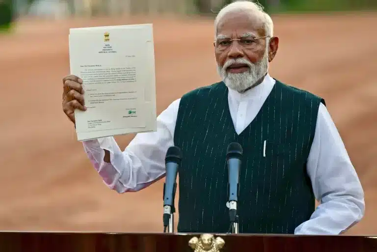 On June 7, 2024, in New Delhi, Indian PM Narendra Modi showcases a letter from President Droupadi Murmu, inviting him to form the next government. This comes amid the fall of Bharatiya Janata Party (BJP) in the 2024 Lok Sabha elections, indicating a decline in Modi's popularity.