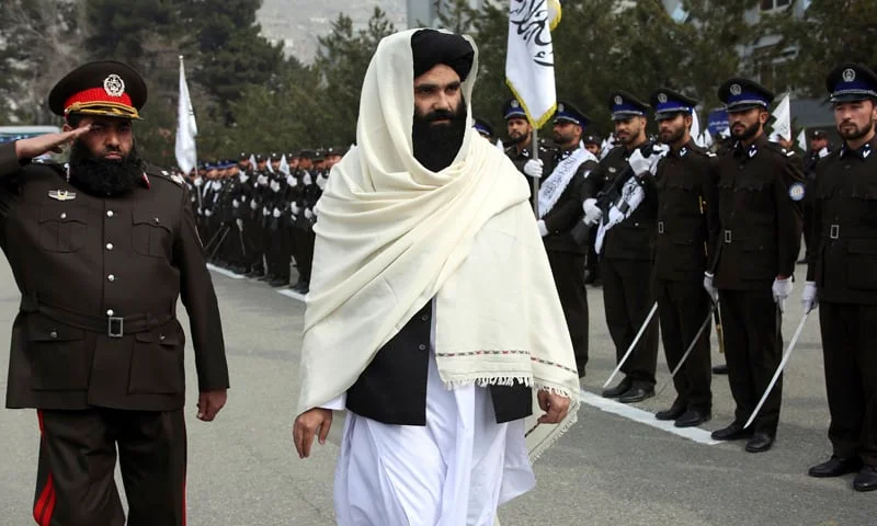 Acting Afghan Interior Minister Sirajuddin Haqqani made his first public appearance to address new Afghan police recruits at a graduation ceremony in Kabul, in March 2022 [Image via AFP].