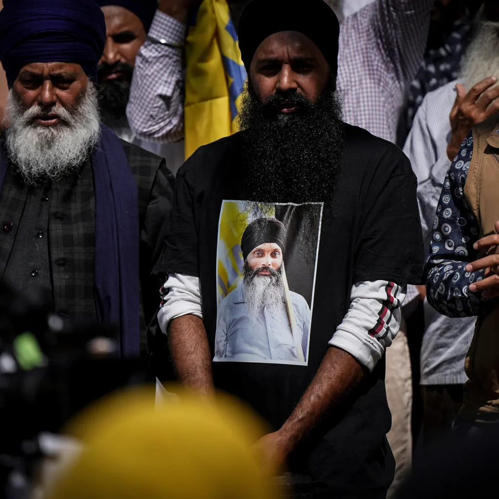 A mourner wears a shirt featuring Sikh activist Hardeep Singh Nijjar before his funeral [Image via AP].