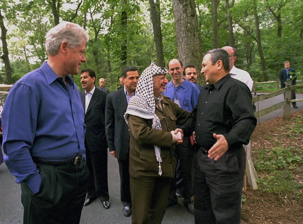 In 2000, Yasser Arafat and Israeli President Ehud Barak joined Bill Clinton at the Camp David Summit [Image via State Dept.].