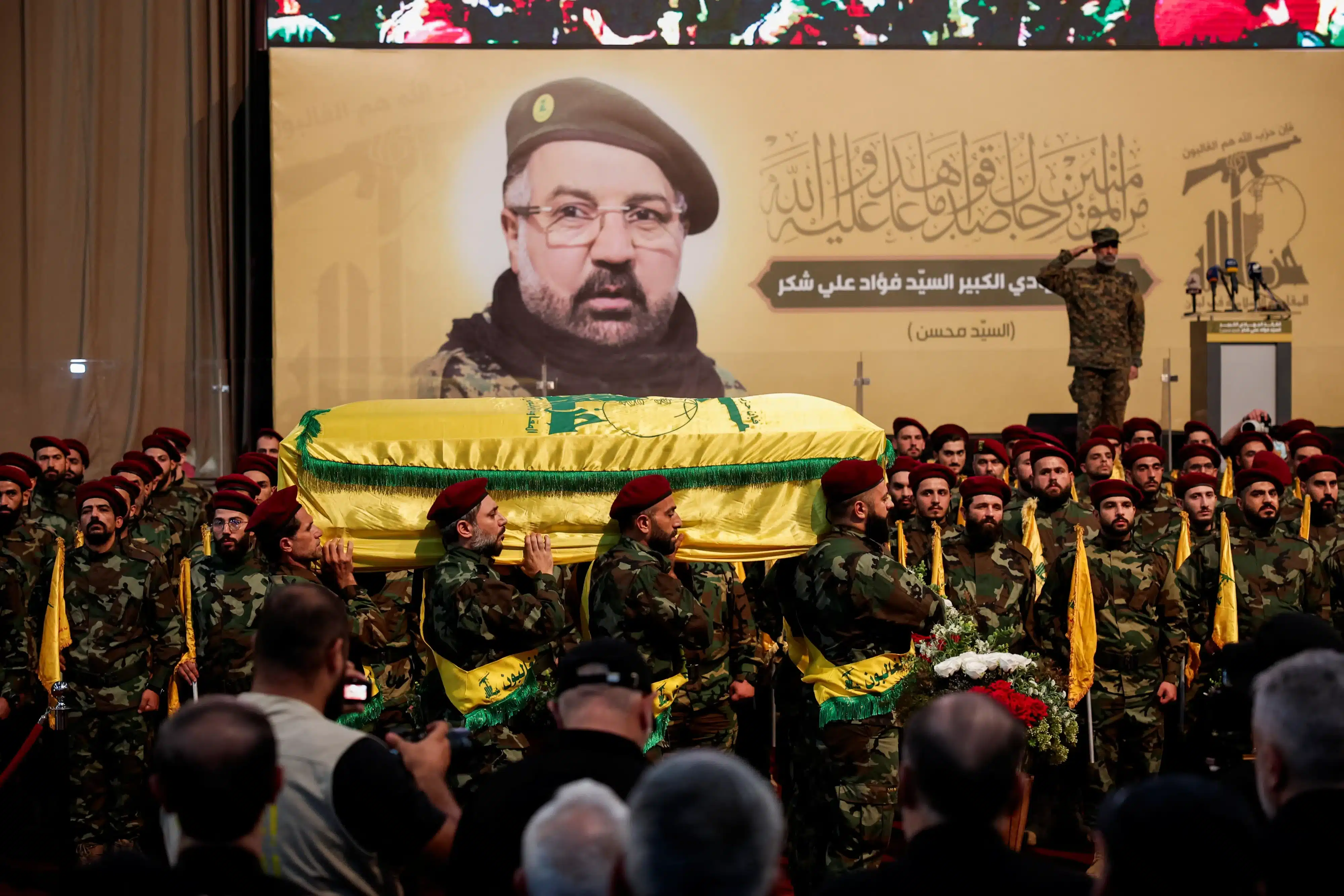 In Beirut's southern suburbs on August 1, 2024, Hezbollah members carry the coffin of senior commander Fuad Shukr, who was killed in an Israeli strike. [REUTERS]