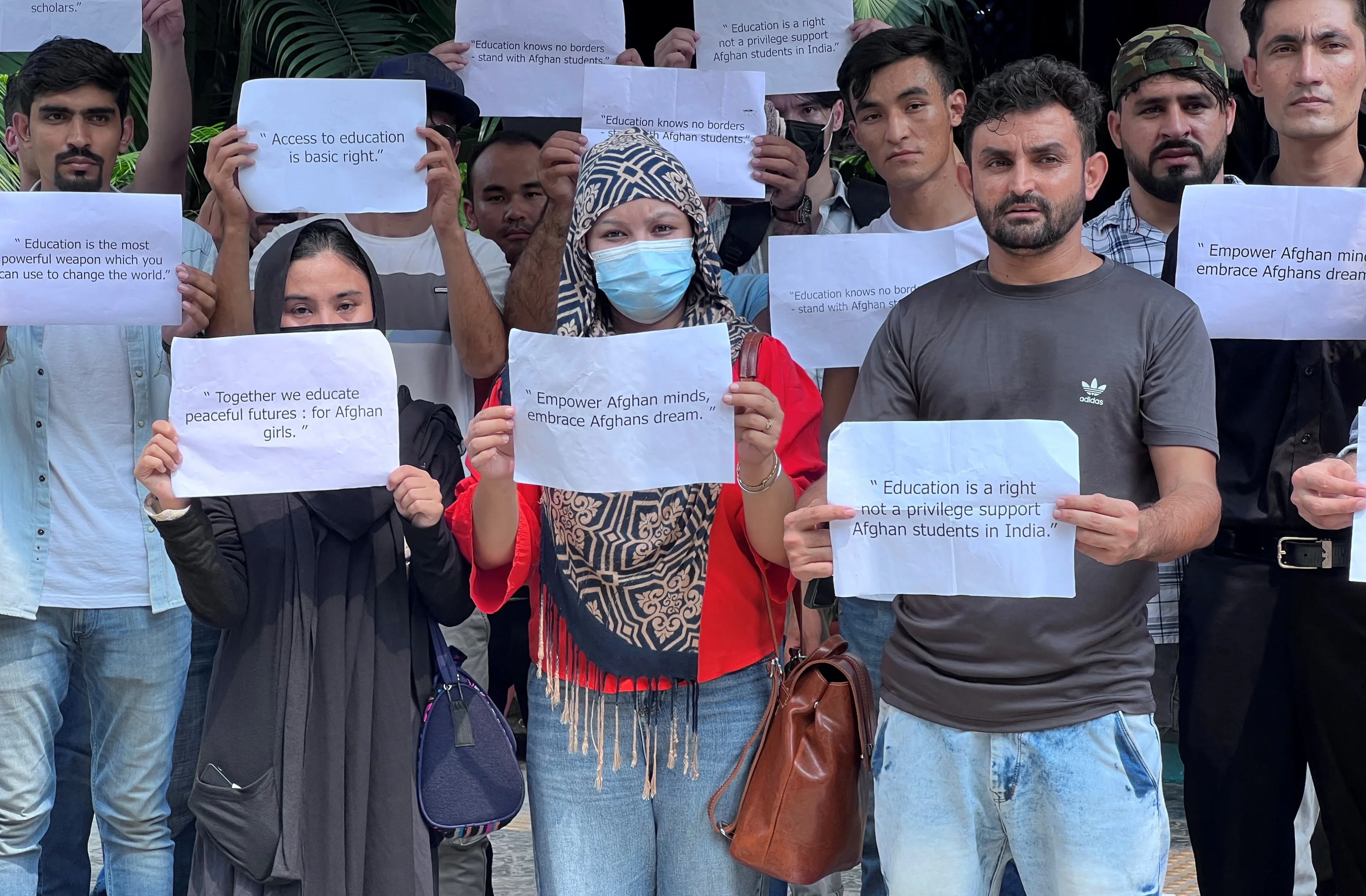 Afghan students living in India hold placards during a protest demanding extension of their study visa and scholarships, in New Delhi, India, September 13, 2023. [Image via REUTERS]