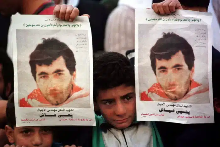 A child holds up a picture of Yahya Ayyash during a demonstration in Palestine.