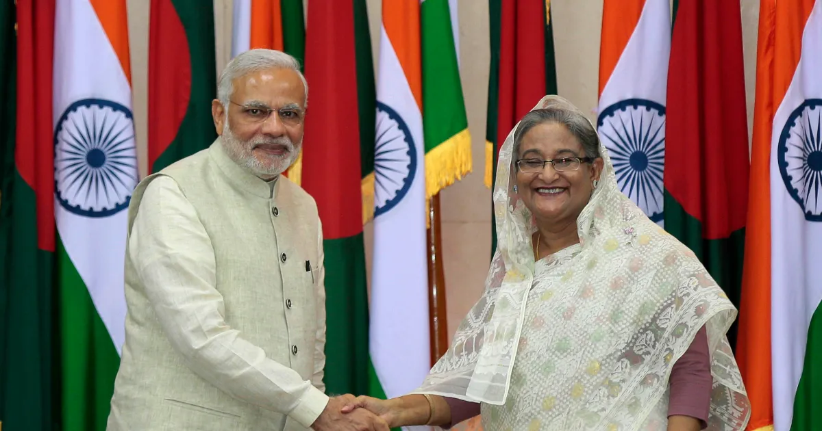 Bangladesh’s PM Sheikh Hasina, right, received ‘political legitimacy’ from India’s PM Narendra Modi [AP]