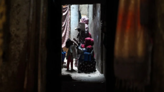 A health worker administers polio vaccine drops during a door-to-door Polio immunisation campaign in Pakistan, June 2024 [Image: Shahzaib Akber EPA-EFE]