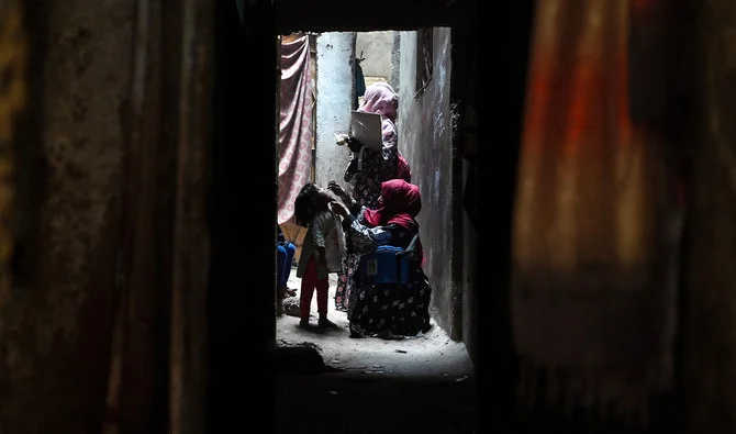 A health worker administers polio vaccine drops during a door-to-door Polio immunisation campaign in Pakistan, June 2024 [Image: Shahzaib Akber EPA-EFE]