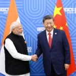 Chinese President Xi and Indian PM Modi discuss boosting communication and cooperation to improve ties after military clashes.