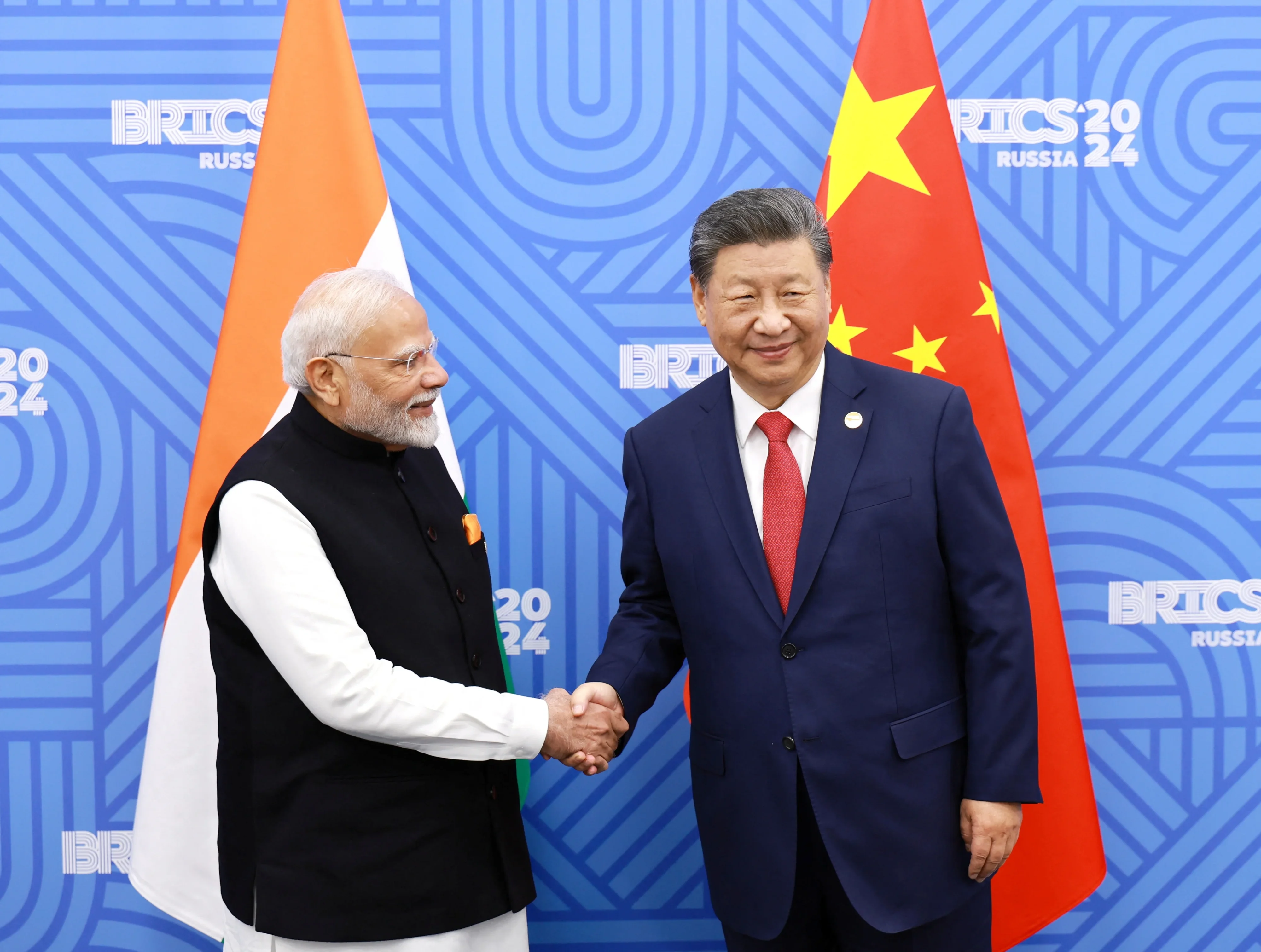 Chinese President Xi and Indian PM Modi discuss boosting communication and cooperation to improve ties after military clashes.