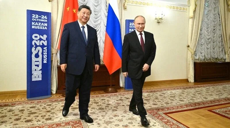  Russian President Vladimir Putin and Chinese President Xi Jinping walk during a meeting on the sidelines of the BRICS Summit in Kazan, Russia October 22, 2024.