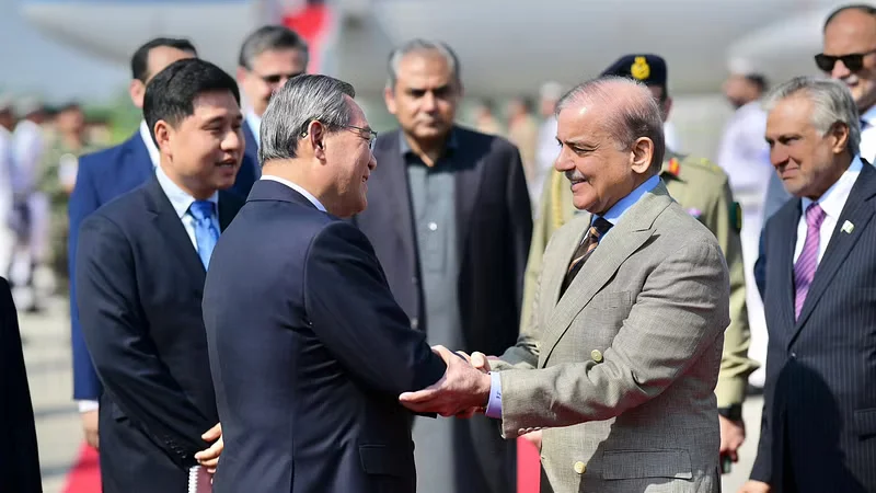 PM Shehbaz Sharif greets Chinese Premier Li Qiang as he arrives in Rawalpindi on Oct 14, 2024 [X]