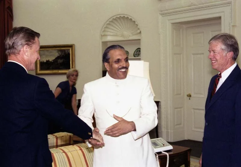 Pakistani dictator General Muhammad Zia-ul-Haq shaking hands with national security adviser Zbigniew Brzezinski; US President Jimmy Carter stands by smiling, 3 October 1980 [Photo from Jimmy Carter Presidential Library]