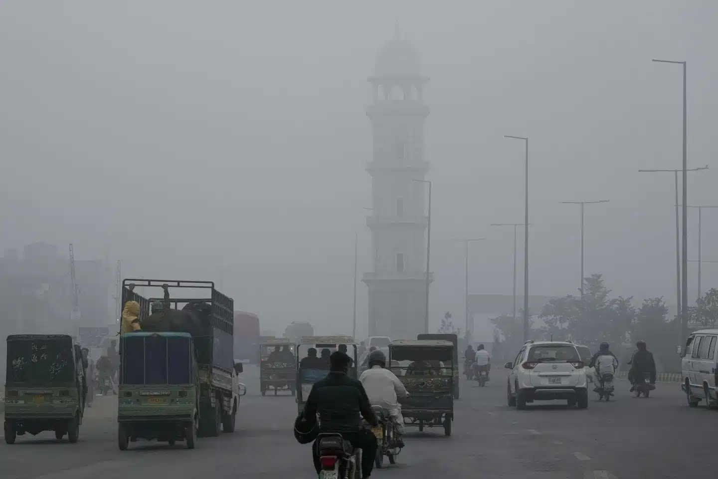 Hazardous smog in Punjab affects 70,000 daily, as mobile clinics reach those in need and schools close to protect children. [Image via AP News]