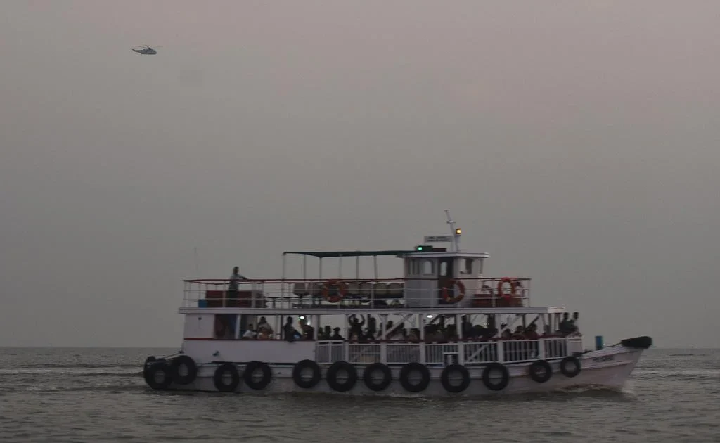 A Navy speedboat collides with a ferry off Mumbai, resulting in 13 deaths and multiple injuries. Rescue efforts underway. [Image via AFP]