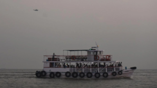 A Navy speedboat collides with a ferry off Mumbai, resulting in 13 deaths and multiple injuries. Rescue efforts underway. [Image via AFP]