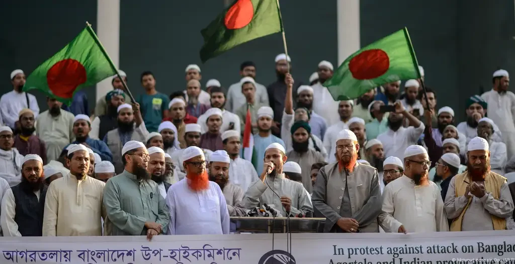 Bangladesh summons India's envoy after consular building attack amid rising tensions over Hasina's ouster and Hindu minority protests. [Image via DW]