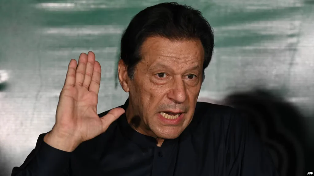 Pakistan indicts ex-PM Imran Khan for inciting attacks on military installations during 2023 protests; PTI denies charges. [Image via VoA News]