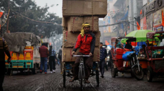 Survey shows Indians' growing pessimism over quality of life as stagnant wages and rising costs cloud future prospects. [Image via Reuters]