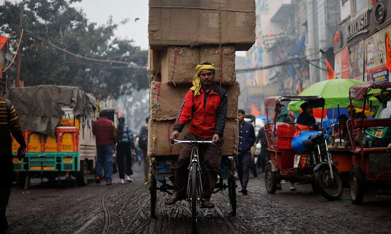 Survey shows Indians' growing pessimism over quality of life as stagnant wages and rising costs cloud future prospects. [Image via Reuters]