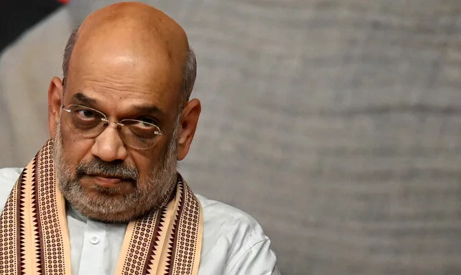 Amit Shah vows to expel illegal Bangladeshis from Delhi if BJP wins, sparking debate ahead of provincial polls. [Image via AFP]