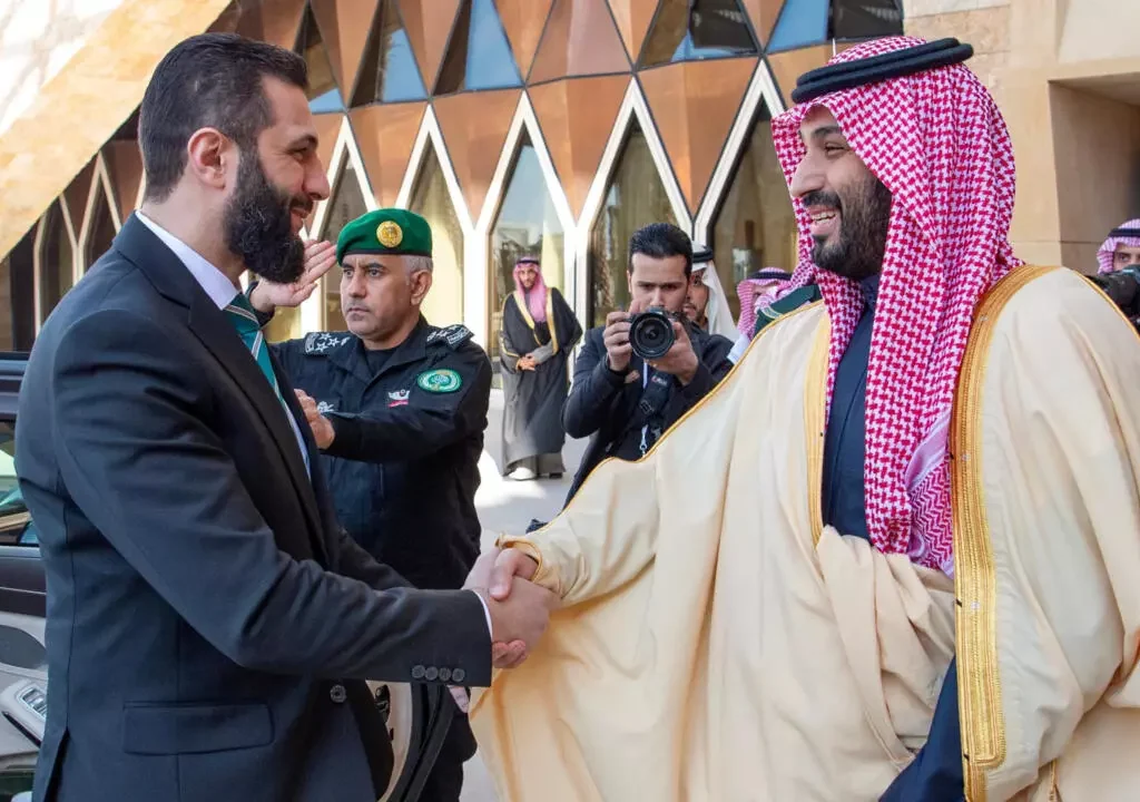 Syria's interim president Ahmed al-Sharaa visits Saudi Arabia, seeking Gulf support for reconstruction and stability. [Image via Reuters]