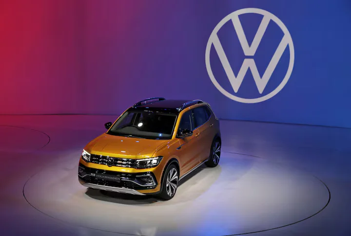 Volkswagen challenges a $14 billion tax demand in India, highlighting concerns over retrospective tax laws. [Image via Reuters]