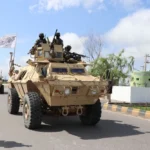 Taliban fighters in armored vehicles, armed with America’s abandoned arsenal in Afghanistan, take part in a military street parade in Herat, Afghanistan, on April 19. [Image via AFP via Getty Images].