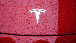 U.S. pushes for zero tariffs on car imports in India, but New Delhi hesitates amid industry concerns and Tesla's entry plans. [Image via Reuters/File]