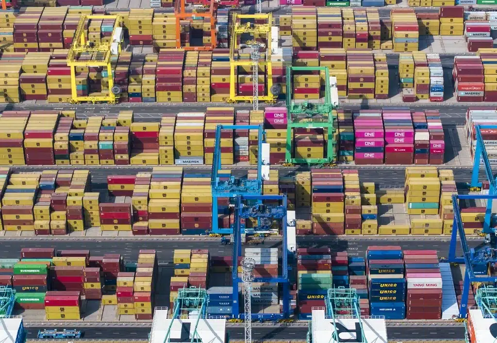 China hits back at US tariff hikes with 84% tariffs, export bans, and WTO complaint, vowing to defend trade interests. [Image via Xinhua]