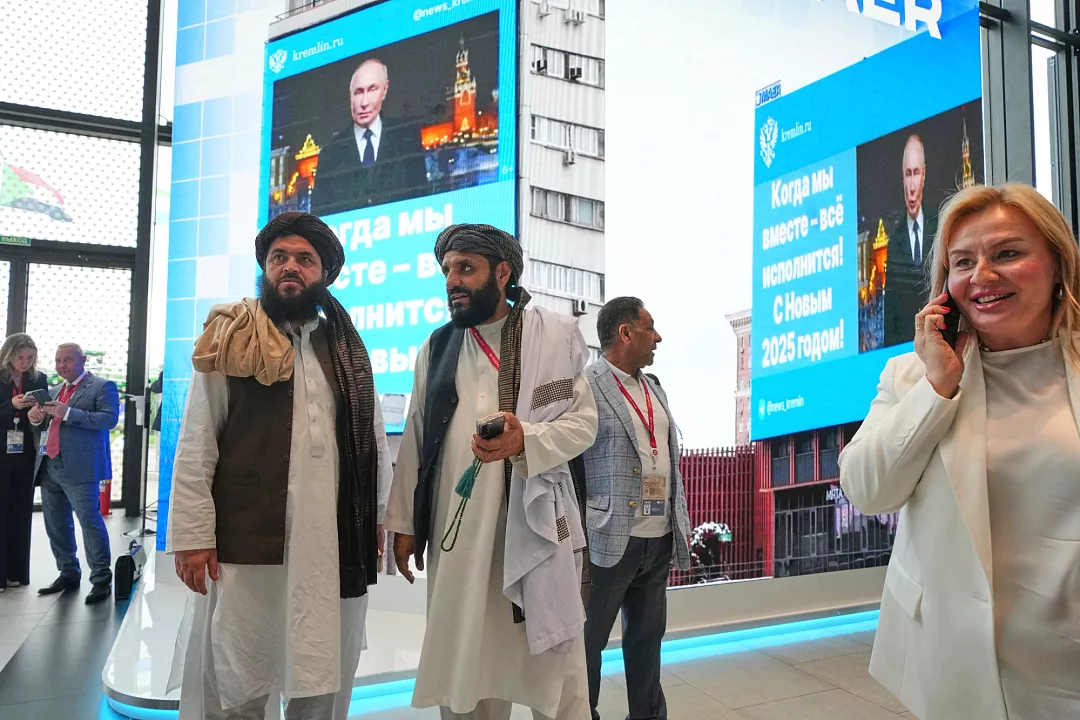 Members of the Taliban stand in front of TV screens as they attend the St. Petersburg International Economic Forum in St. Petersburg, Russia, Wednesday, June 18, 2025 AP Photo