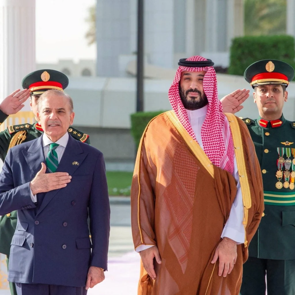 Saudi Crown Prince Mohammed bin Salman and Pakistan Prime Minister Shehbaz Sharif standing together during an official ceremony in Riyadh