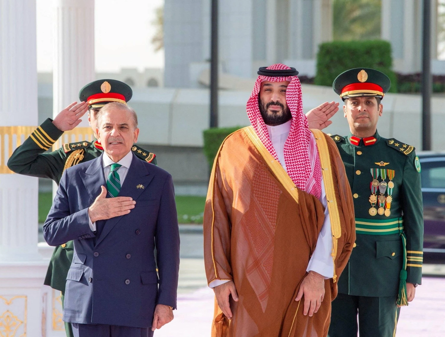 Saudi Crown Prince Mohammed bin Salman and Pakistan Prime Minister Shehbaz Sharif standing together during an official ceremony in Riyadh