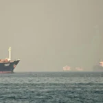 Cargo ships and tankers in the Strait of Hormuz in the northern Emirate. Photographer: Giuseppe Cacace/AFP/Getty Images