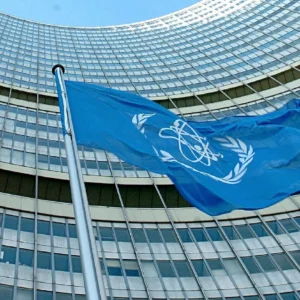 The flag of the International Atomic Energy Agency IAEA waves in front of the IAEA