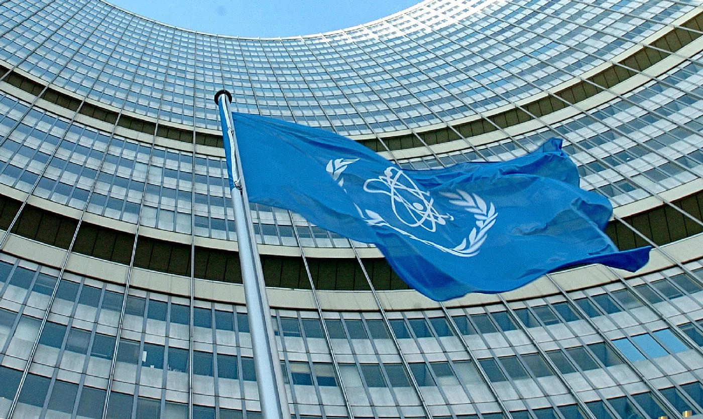 The flag of the International Atomic Energy Agency IAEA waves in front of the IAEA