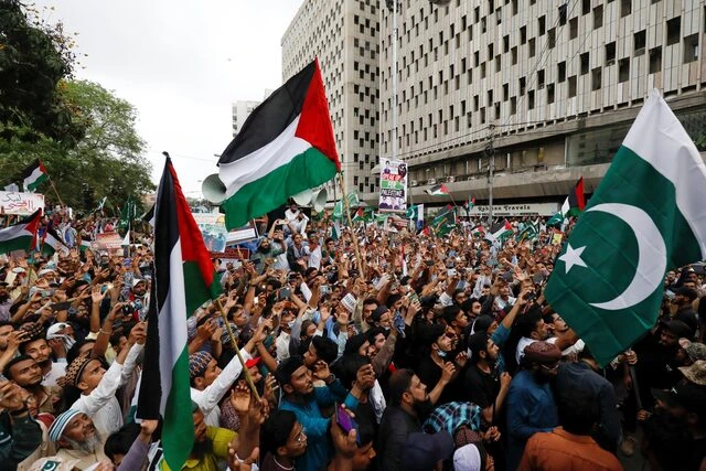 People express solidarity with Palestinian people and to protest against Israel, during a rally in Karachi, Pakistan