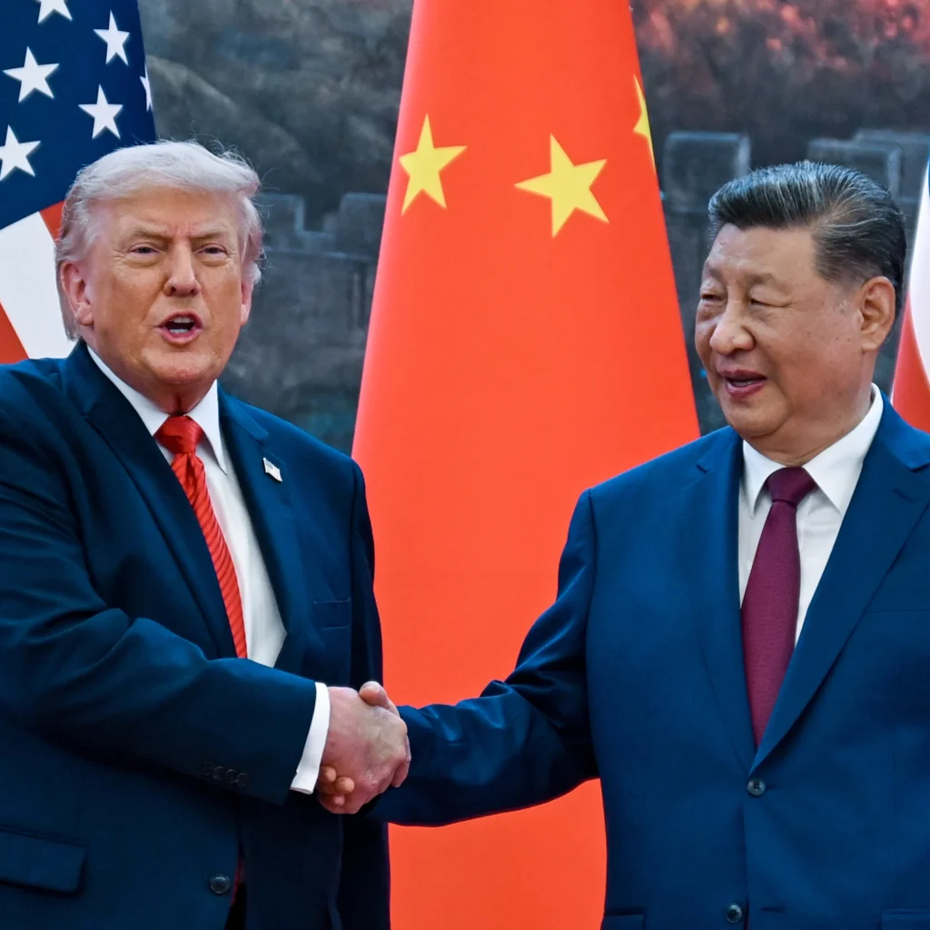 US President Donald Trump shakes hands with Chinese leader Xi Jinping at the Great Hall of the People in Beijing on Thursday, May 14