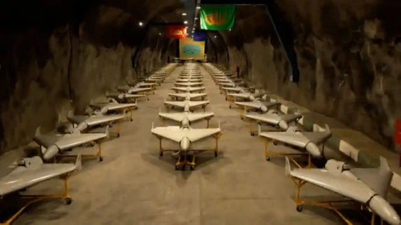Rows of Shahed-style military drones displayed inside an underground storage facility, highlighting Iran’s low-cost unmanned warfare capabilities.