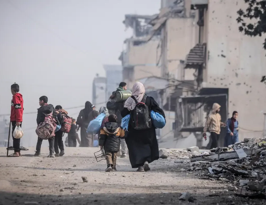 Displaced Palestinians make their way back to their homes in northern Gaza.