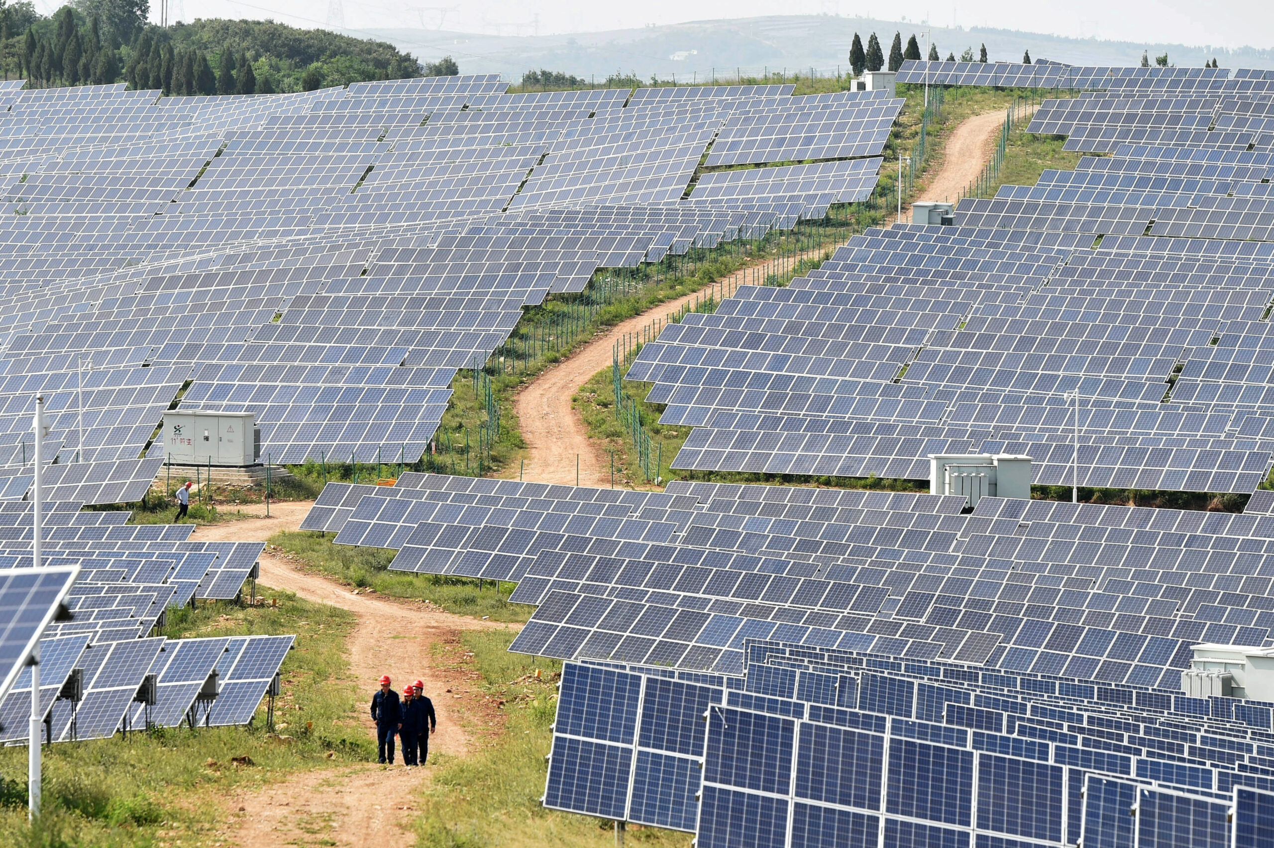 Solar panels are seen at a solar power plant in Pingdingshan, Henan province, China June 7, 2018. Picture taken June 7, 2018.  REUTERS/Stringer/File Photo