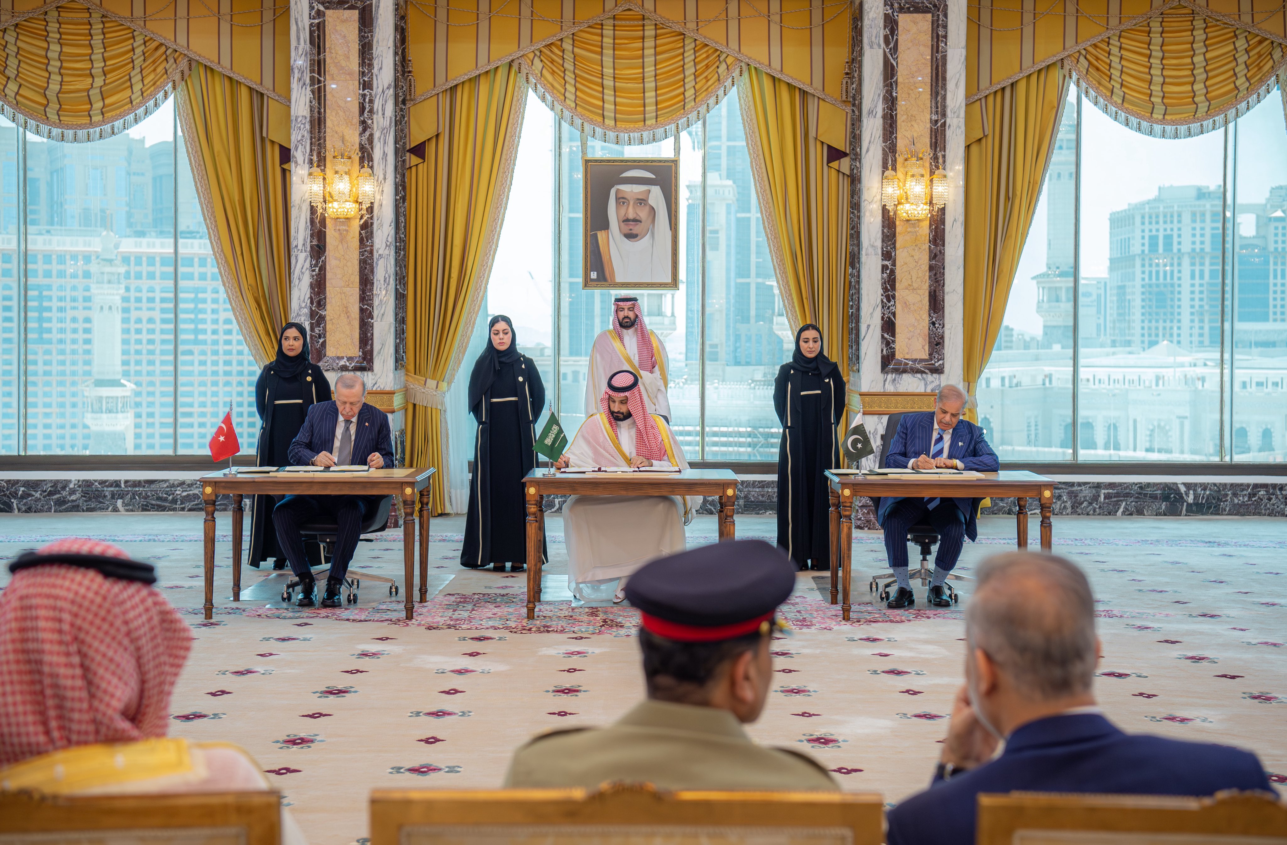 The three leaders signing the Makkah Joint Defense Agreement at Al-Safa Palace, Makkah, 7 August 2026. Source: Pakistan Ministry of Foreign Affairs / Saudi Press Agency.