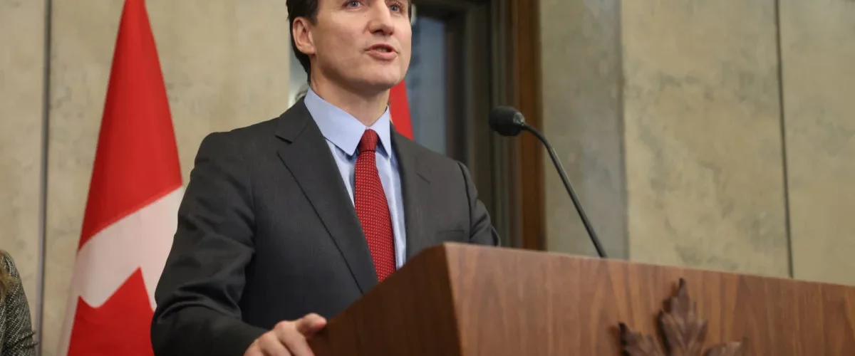 Trudeau calls Trump's tariffs "very dumb," vows retaliation as U.S.-Canada trade war escalates, hitting key industries. [Image via PBS News]