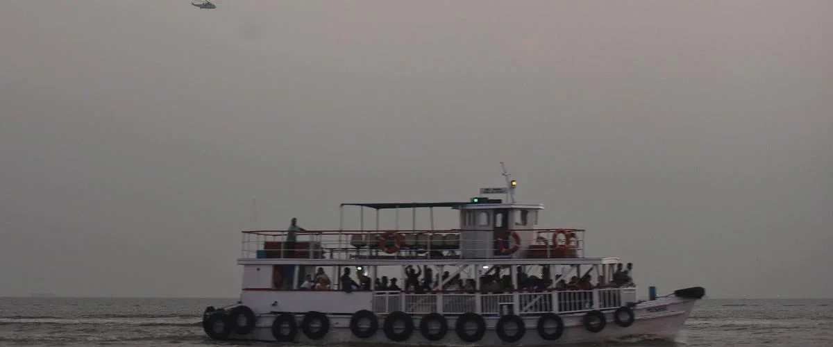 A Navy speedboat collides with a ferry off Mumbai, resulting in 13 deaths and multiple injuries. Rescue efforts underway. [Image via AFP]